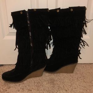 Black tasseled tall boot